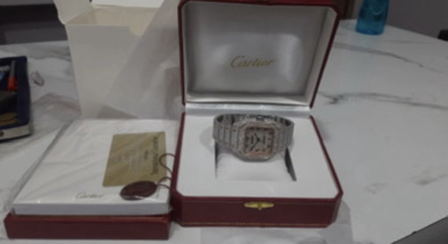 Iced watch sitting in a red box