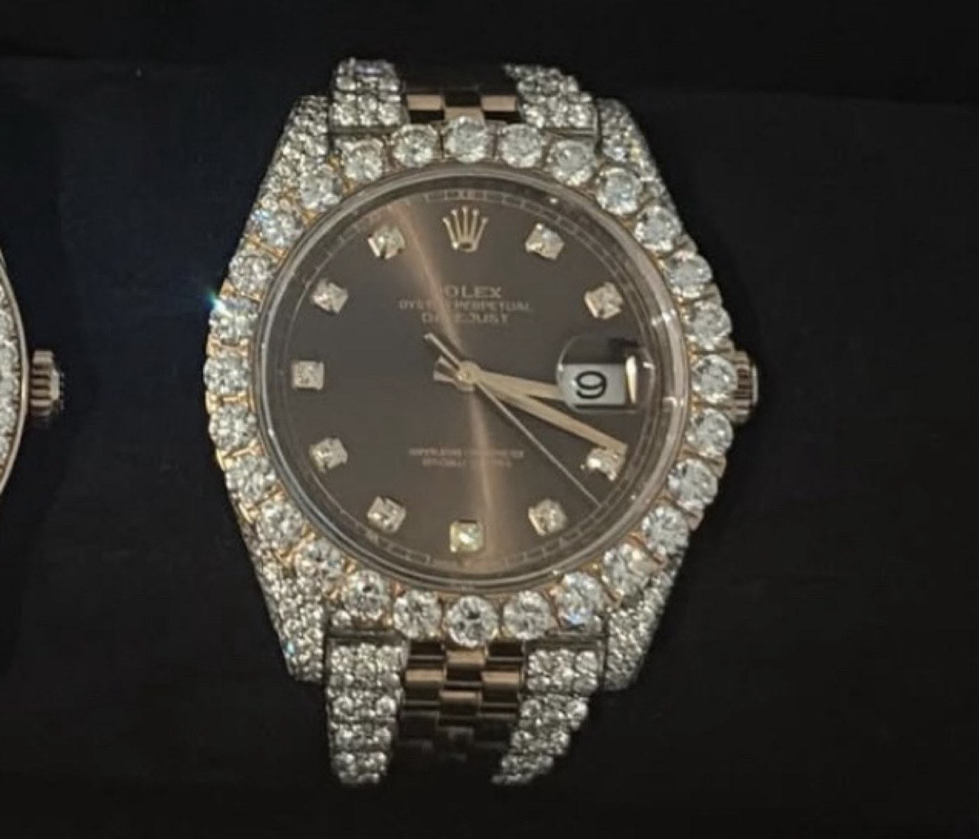Iced watch with a dark dial